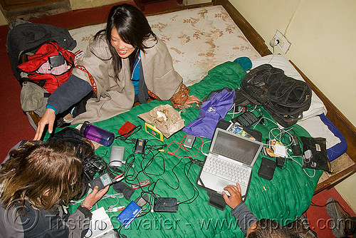 ben's laptop is connected to all kinds of usb devices in hotel room - leh (india), ben, computer, copying, devices, electronics, gadgets, ibook, ladakh, laptop, mac, netbook, sharing, usb, wires