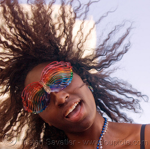 black girl with rainbow carnival mask, black woman, carnival mask, gay pride festival, rainbow colors