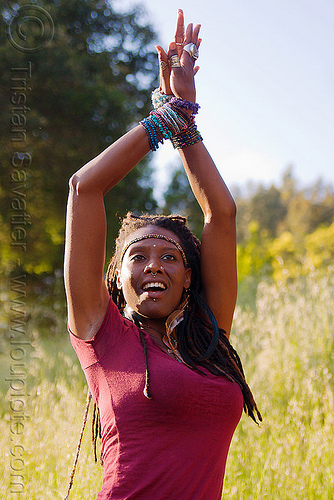 black woman dancing - arms up, black woman, bracelets, dancing, headband, lala love, spring training, thin dreadlocks