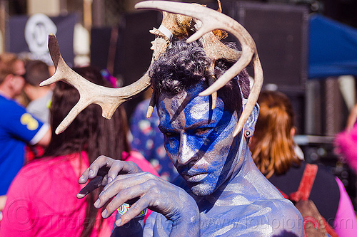 blue elf with antlers headdress, antlers, blue facepaint, headdress, man