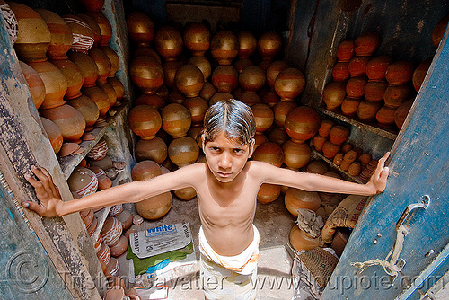 boy guarding water-pots shop - jaipur (india), boy, door, india, jaipur, shop, water jugs, water pots
