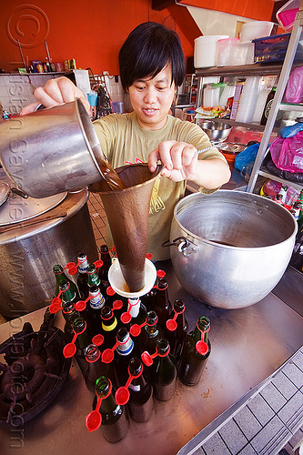 brewing a local concoction, borneo, botteling, drink, home-made, infused, infusion, malaysia, man, miri, sift, sifting