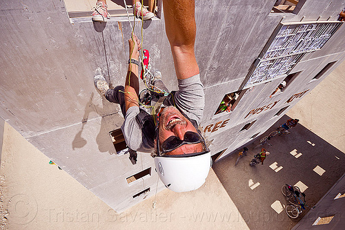 burning man - abseiling wall street building, abseiling, buildings, climbing harness, climbing helmet, descender, descendeur, goldman sucks, man, mountaineering helmet, petzl, rappelling, rock climbing, selfie, selfportrait, single rope, static rope, vertical, wall street