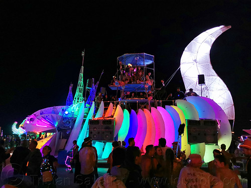 burning man - axolotle art car, axolotle art car, burning man art cars, burning man at night, glowing, mutant vehicles