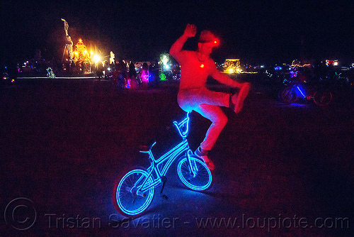 burning man - blake hicks - freestyle bmx bike tricks, acrobatics, balancing, bicycle, blake hicks, burning man at night, el-wire, flatland bike, flatland bmx, freestyle bmx, freestyling, glowing, trick, tron bike