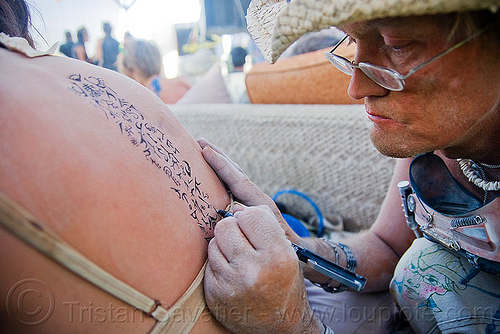 burning man - body painting at the center camp cafe, artist, body art, body paint, body painting, damien, drawing, hyeroglyphs, skin, symbols, writing