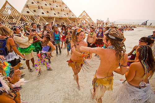 burning man - bride and groom dancing at their handfasting, bride, burning man temple, groom, handfasting, temple of whollyness, wedding, wooden pyramid