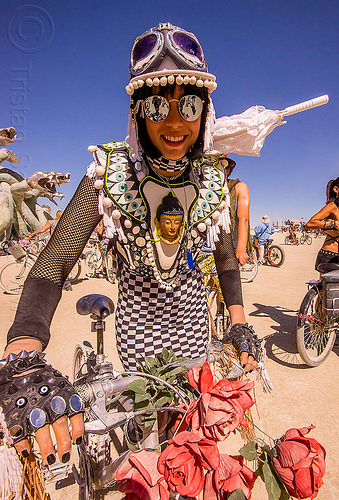 burning man - buddha costume, attire, bicycle, buddha, burning man outfit, checkered dress, costume, fingerless gloves, goggles, riding, sunglasses, white umbrella, woman