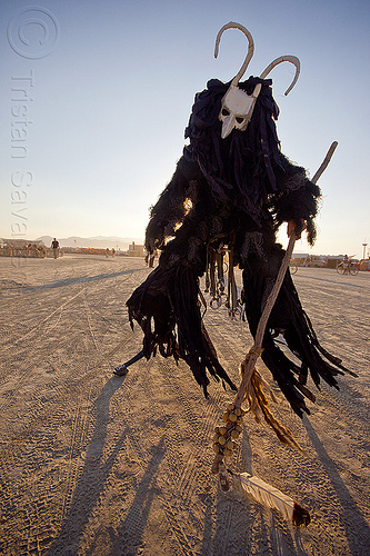 burning man - cernunnos - horned god, attire, burning man outfit, cane, ceremonial staff, ceremonial stick, cernunnos post modern celtic deity, costume, demonic, evil spirit, horned, mask, masked, performance, shaman, stilter, stilts