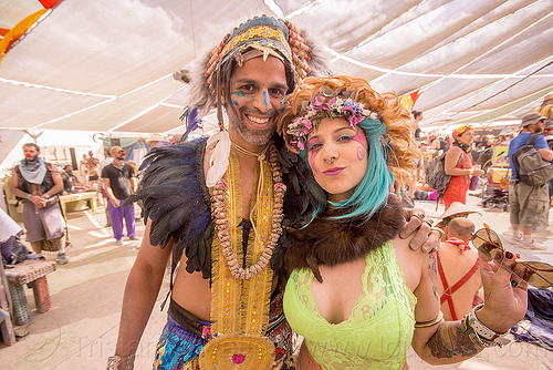 burning man - couple - center camp, attire, burning man outfit, feathers, headdress, necklace, tribal costume, woman