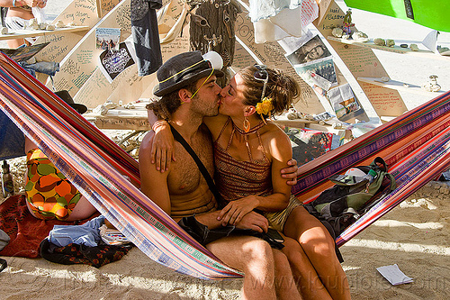 burning man - couple kissing on hammock in temple, burning man temple, hammock, inside, interior, kiss, kissing, lovers, making out, mementos, temple of whollyness, woman
