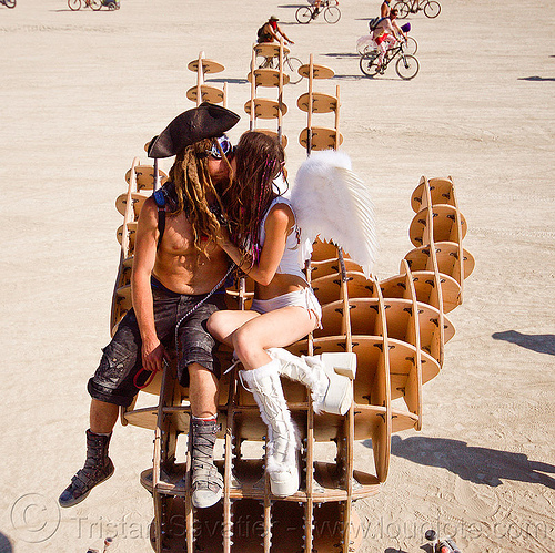 burning man - couple kissing on hands sculpture, angel, art installation, david gerler, hands sculpture, kissing, making out, man, pirate, sitting, woman, wooden frame