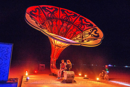 burning man - couple sitting under la victrola - giant gramophone, art installation, burning man at night, giant gramophone, la victrola