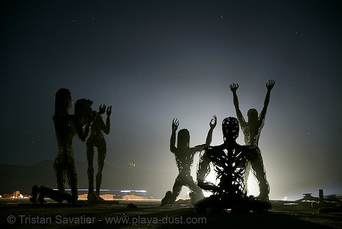 burning man - crude awakening, art installation, back light, burning man at night, sculptures