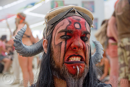 burning man - devilish face paint - the adam pope, body piercingface paint, face painting, facepaint, goggles, man, piercing, red, the adam pope