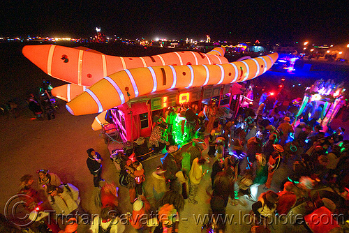 burning man - disorient art car blasting music at the bee hive, akairways, art car, art installation, burning man art cars, burning man at night, crowd, dancing, disorient, glowing, inflatable art, mutant vehicles, worms