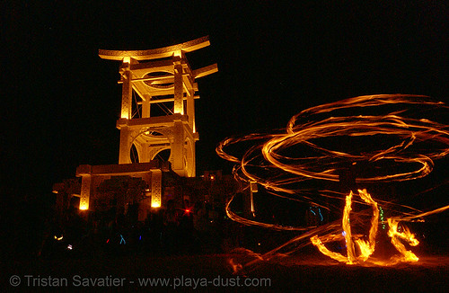 burning man - fire dancer near the temple of forgiveness, burning man at night, fire dancer, fire dancing, fire performer, fire spinning, temple of forgiveness