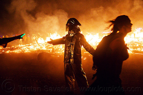burning man - fire line, backlight, burning man at night, fire proximity suit, firefighter, helmet, night of the burn, silhouettes, the man