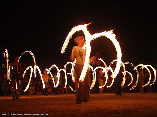 burning man - fire spinners - fire conclave training, burning man at night, fire dancer, fire dancing, fire performer, fire poi, fire spinning, spinning fire