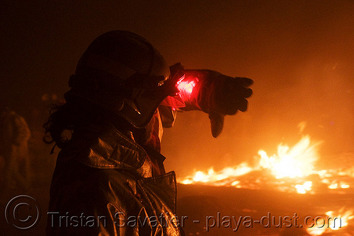 burning man - firefighter watches over the embers of the man, burning man at night, fire, firefighter, temple burning