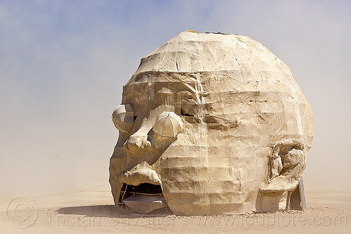 burning man - giant baby head, art installation, baby head, child head, psychokinetic child, sculpture