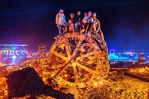 burning man - giant gears, burning man at night, embers, fire