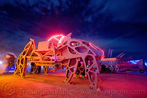 burning man - giant motorized mechanical spider - the walking beast, art car, biomimicry, burning man art cars, burning man at night, glowing, mechanical spider, moltensteelman, motorized spider, mutant vehicles, walker, walking beast, walking machine