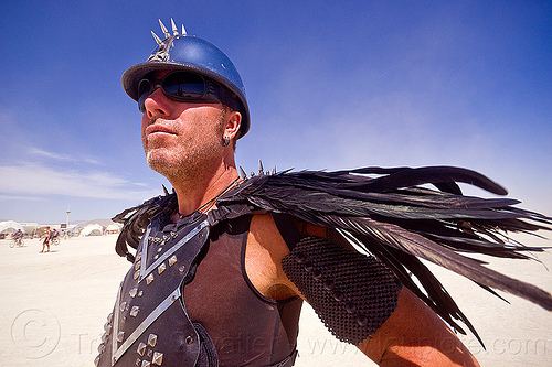 burning man - gladiator costume with black feathers, attire, black feathers, burning man outfit, gladiator costume, helmet, unshaven man