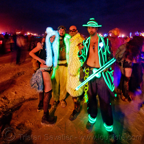 burning man - glowing and el-wire costumes - lisa, casson and friends, burning man at night, casson trenor, el-wire costume, gangster, glow costumes, glowing costumes, hand gun, lisa wong, machine gun, shot gun, thompson submachine gun, tommy gun