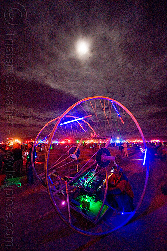 burning man - glowing art car under the full moon, burning man art cars, burning man at night, full moon, glowing, mutant vehicles, unidentified art car