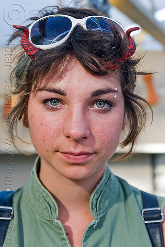 burning man - green eyed girl, devil horns, eyebrow piercing, green eyed, green eyes, marie, sunglasses, woman