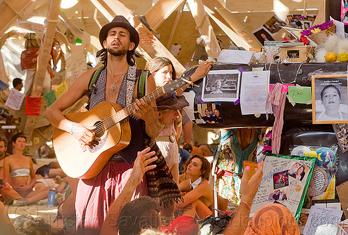 burning man - guitar player in temple, burning man temple, contemplatiing, guitar player, inside, interior, mementos, musician, playing, temple of whollyness