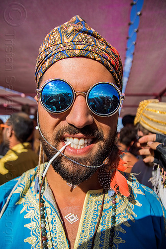 burning man - iman hosseini - persian prince, attire, beard, blue, burning man outfit, chain, hat, mirror sunglasses, persian prince, round sunglasses