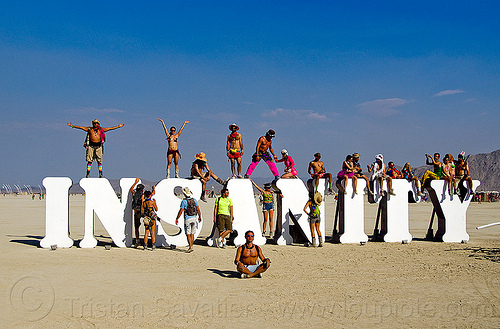 burning man - insanity, art installation, crowd, insanity, letters