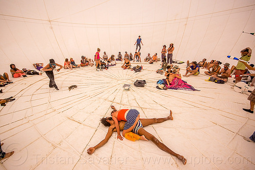 burning man - inside playa moon - big white inflatable sphere, art installation, inflatable ball, inflatable sphere, playa moon, spread eagle, white ball
