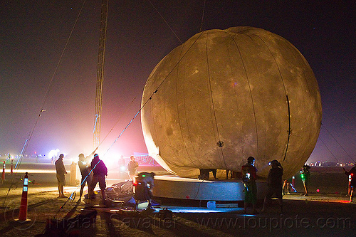 burning man - installing the giant inflatable moon, burning man at night, inflatable moon, lune and tide, silhouettes