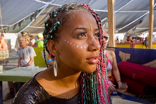 burning man - jasmine at center camp cafe, bindis, braid, braided hair, earrings, eyelashes extensions, makeup, woman