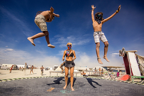 burning man - kids on trampoline, bandanas, bouncing, boys, brothers, campoline camp, children, jump, jumpshot, kids, mother, trampoline, woman