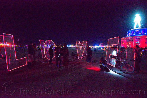 burning man - l.o.v.e bicycles, bicycles, bikes, burning man at night, el-wire, glowing, letters, love