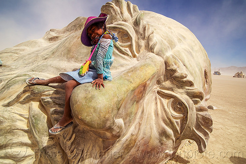 burning man - little girl on da vinci's nose, art installation, child, da vinci head, giant head, kid, little girl, sculpture