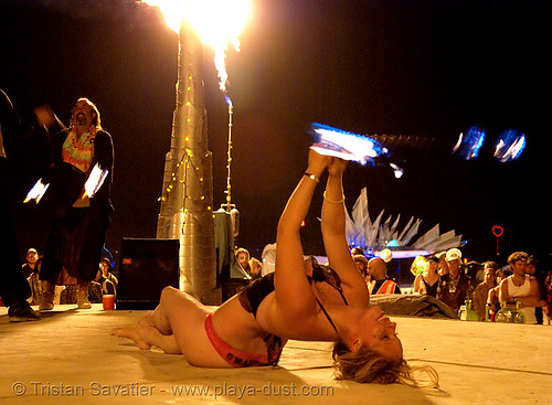 burning man - louise, from ireland, spinning fire on the shiva vista stage, burning man at night, fire poi, shiva vista stage