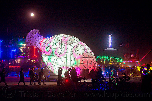 burning man - love potion art car, bottle art cat, burning man at night, full moon, glowing, love potion art car, the man