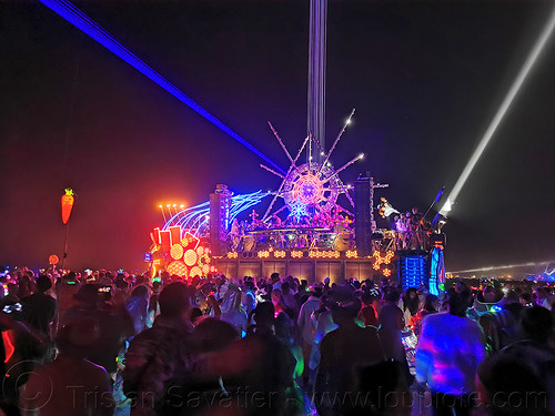 burning man - mayan warrior art car, burning man art cars, burning man at night, glowing, lasers, mayan warrior art car, mutant vehicles