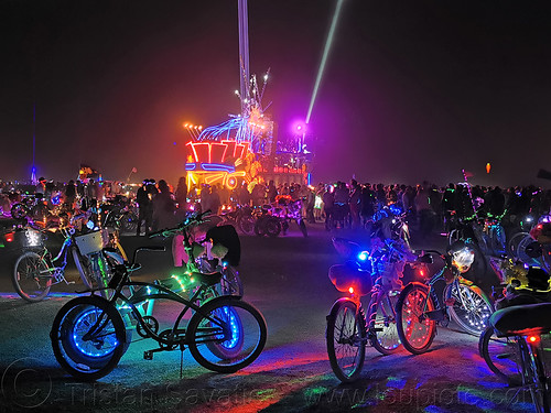 burning man - mayan warrior art car, burning man art cars, burning man at night, glowing, lasers, mayan warrior art car, mutant vehicles