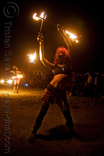 burning man - mumu mariane charline spinning fire staffs, burning man at night, double staff, fire staffs, fire staves, woman