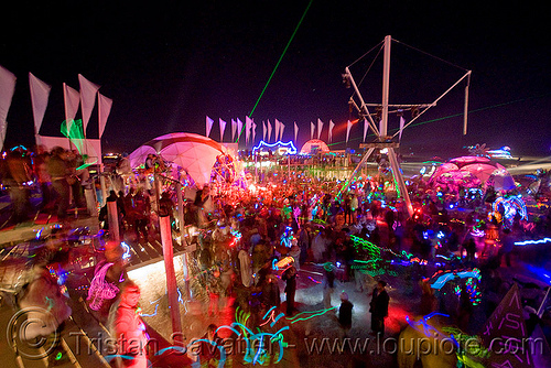 burning man - nexus camp, burning man at night, dancing, glowing, nexus theme camp