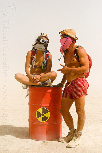 burning man - nuclear waste drum, barrel, drum, dust storm, man, nuclear waste, radioactive waste, red, sitting, white out, woman