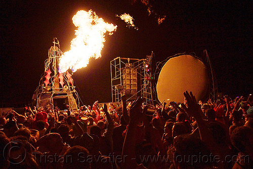 burning man - opulent temple, burning man at night, crowd, dancing, fire cannon, opulent temple
