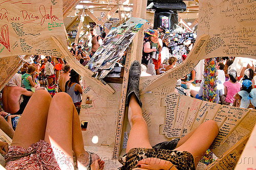 burning man - people and mementos in the temple, burning man temple, contemplatiing, graffiti, inside, interior, laying down, mementos, temple of whollyness, writing