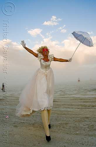 burning man - performer on stilts - jesster, attire, burning man outfit, circus metropolus, jessica, jesster, stilts, stiltwalker, stiltwalking, umbrella